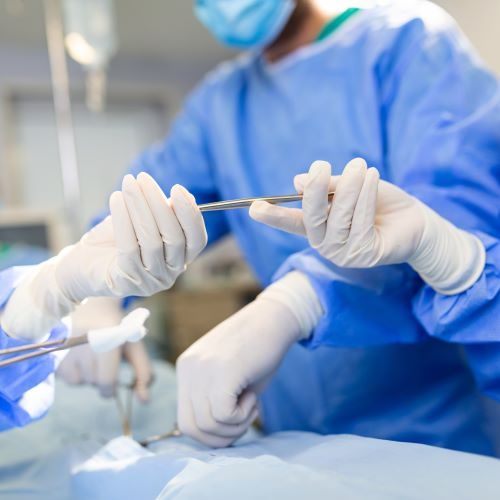 low-angle-shot-operating-room-assistant-hands-out-instruments-surgeons-during-operation-surgeons-perform-operation-professional-medical-doctors-performing-surgery